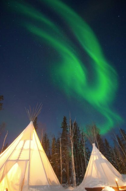 You don't have to bundle up to watch the #Aurora if you hang out in these cosy teepees at <a href="/AuroraVillage/">Aurora Village</a>. #ExploreCanada #NorthernLights