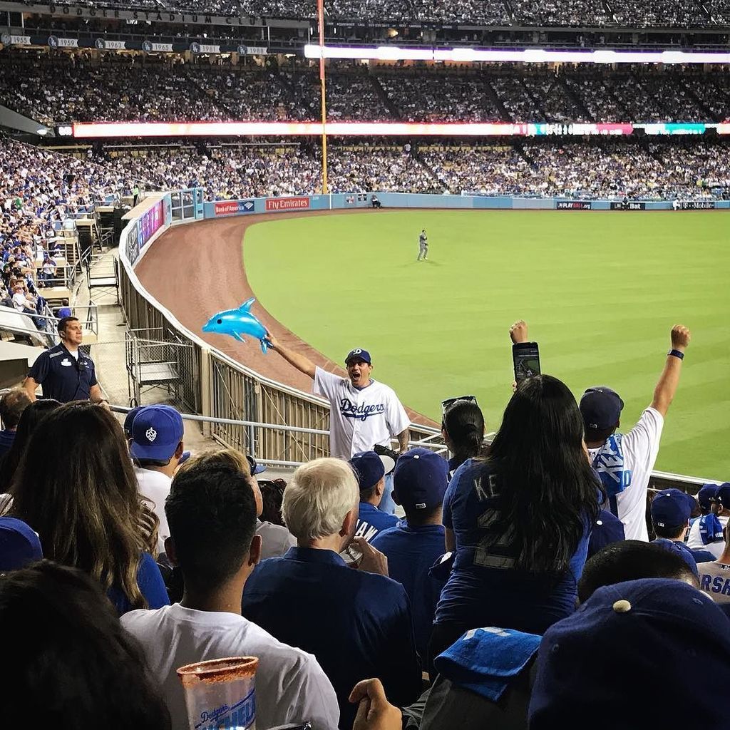 thomasypark's tweet photo. This creative guy is using a dolphin to start the wave. 🌊 #itfdb #2017nlcs #letsgododgers #watchthegame #stillfunny https://t.co/pphbJKbFKD https://t.co/oHDJRV920W