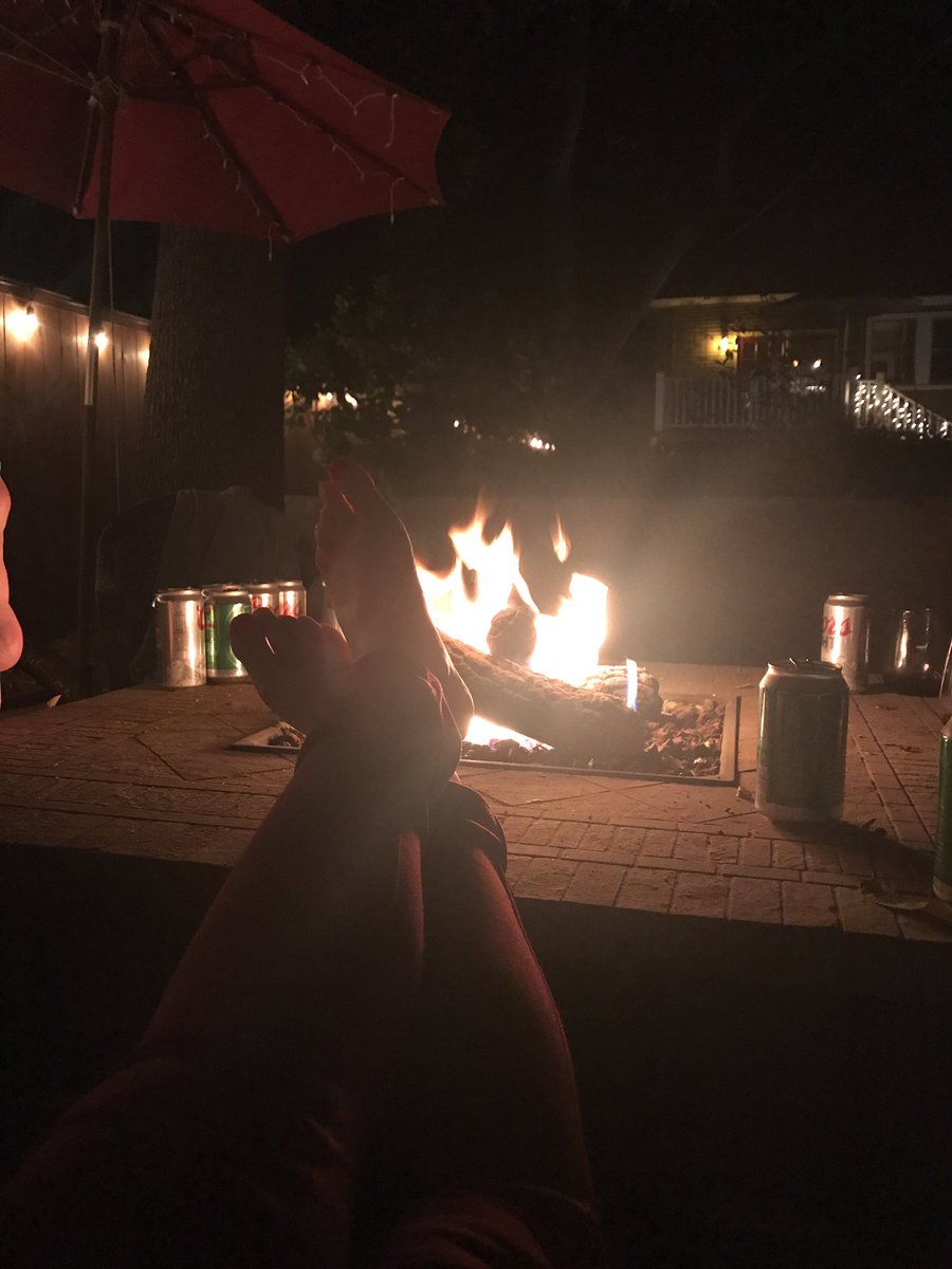 Kickin back, drinking beer and enjoying a nice fire