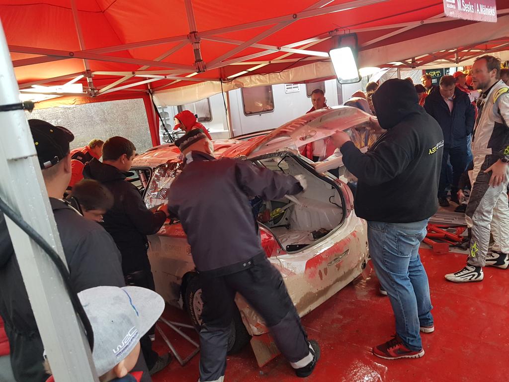 The busiest service area. Lots of people in <a href="/Auto_Akademija/">Autosporta Akadēmija</a> tent working on <a href="/MSesks/">Mārtiņš Sesks</a> car after roll in <a href="/FIAERC/">FIA European Rally Championship</a> <a href="/LVRally/">Tet Rally Latvia</a>