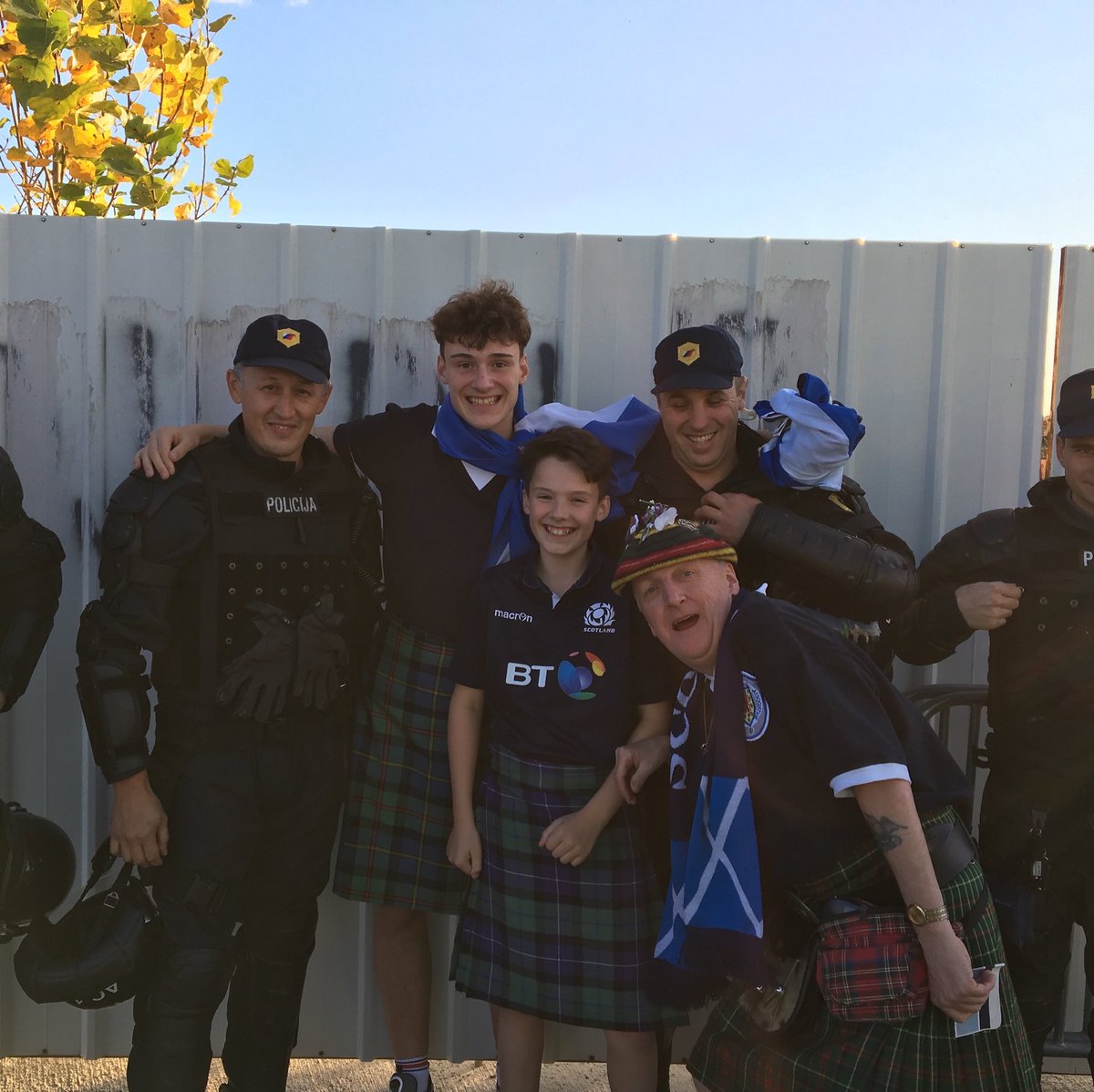 GhilleanMacLeod's tweet photo. My boys with the local riot police (and another #tartanarmy person?!) when we were happy. #beforegame #SLOSCO https://t.co/kCqpBqm433