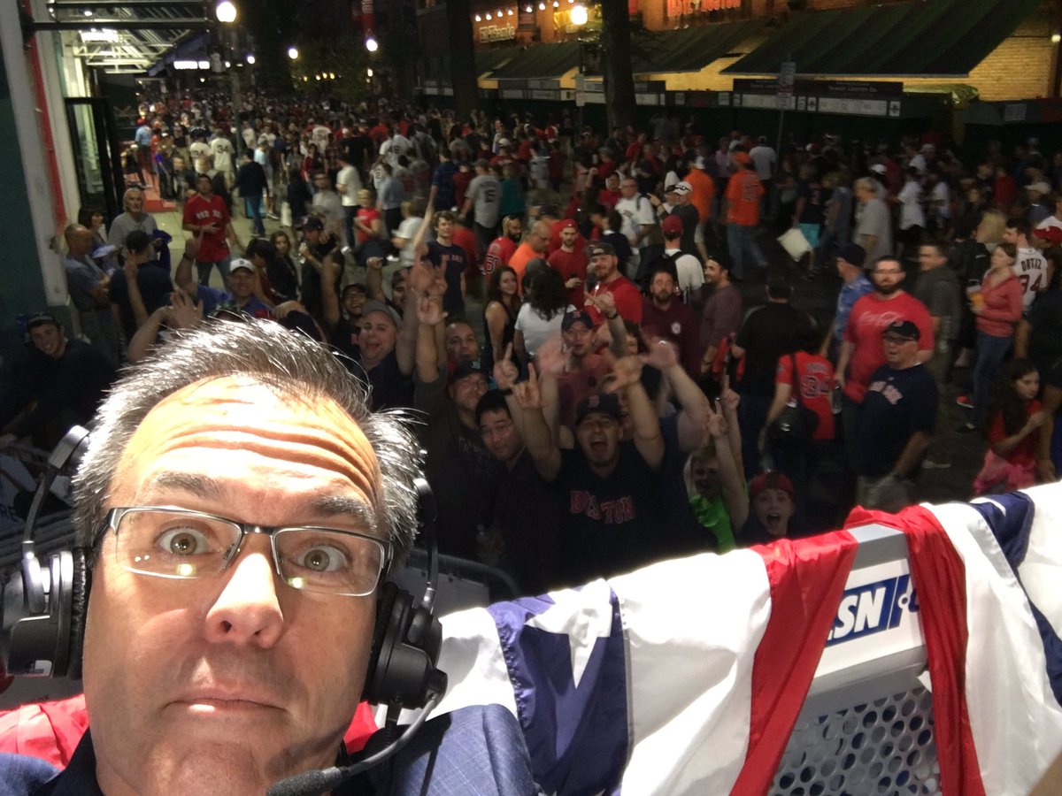 TomCaron's tweet photo. Pretty rowdy here on Yawkey Way after #redsox win in Game 3.  Post-game show on @NESN now! https://t.co/2Jn70MbHkS