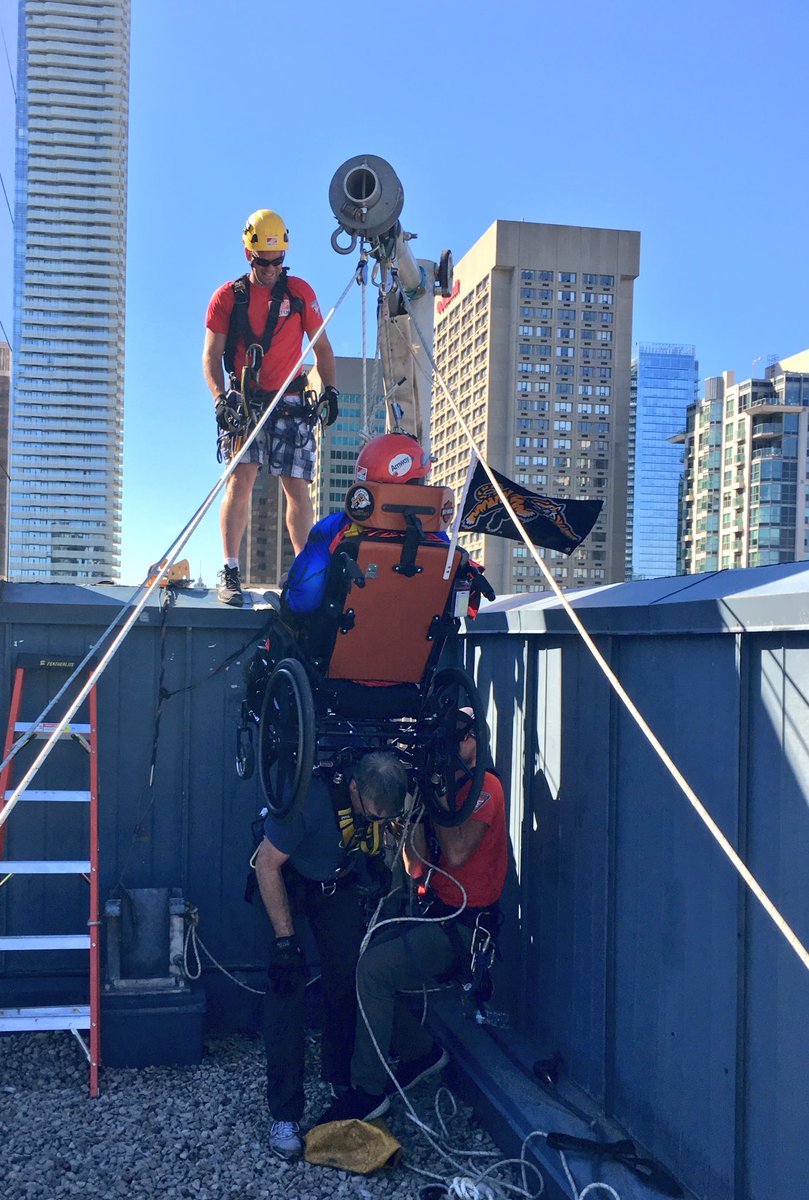 AndrewONielsen's tweet photo. Getting hoisted up into position go over the wall! Great view up here. 👀🏢 @EasterSeals #dropzonetoronto https://t.co/1YHv6lLxWT