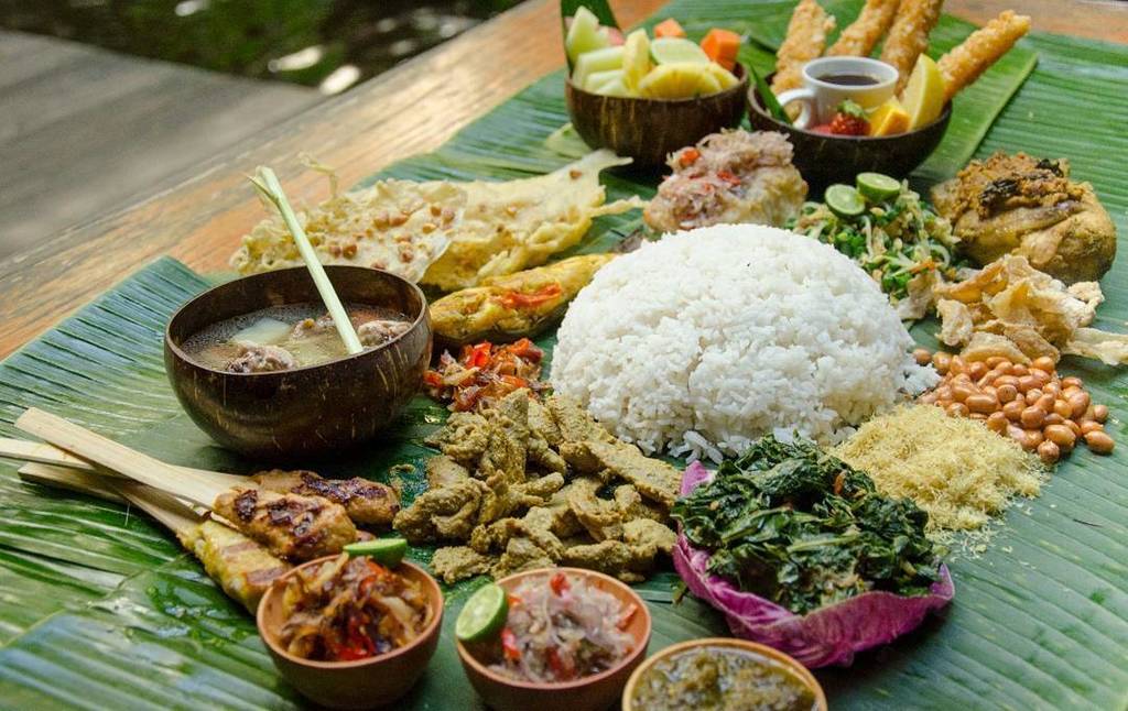 Balinese cuisine is a cuisine tradition of Balinese people from the volcanic island of Bali. Using a variety of spices, blended with the fr…