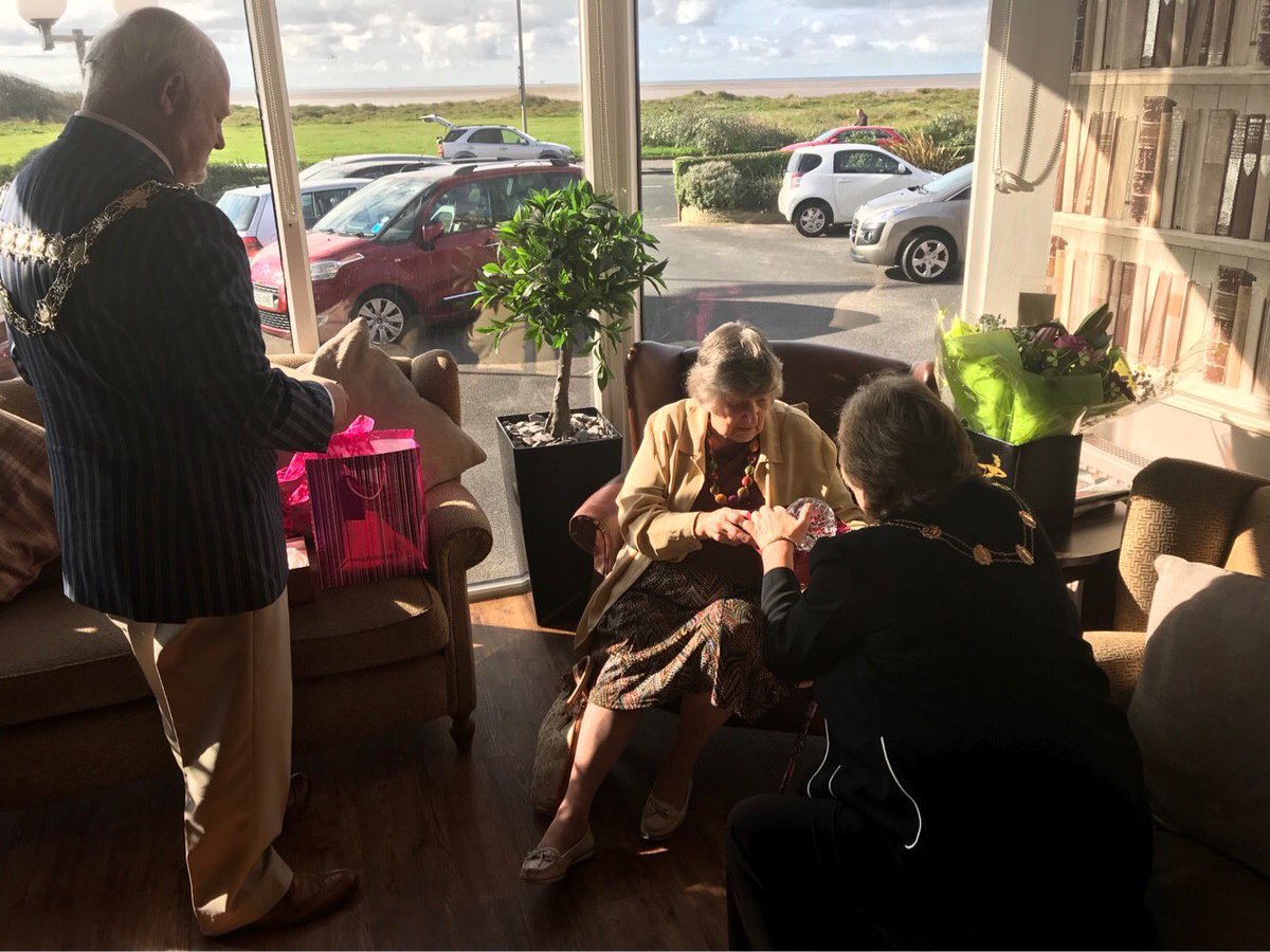 Mayor Presents gifts to 84 year old Barbara Johnson who hasn't missed a visit since 1933!