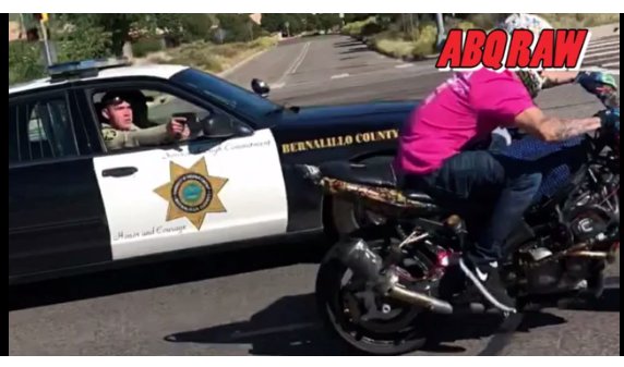 mercenarygeo's tweet photo. Cop aims gun at motorcyclist for doing a wheelie: https://t.co/c9s99yWaq9 #Albuquerque #APDProtest #NewMexico #BadCops #InvestigatePolice https://t.co/u5VqcjwaK9