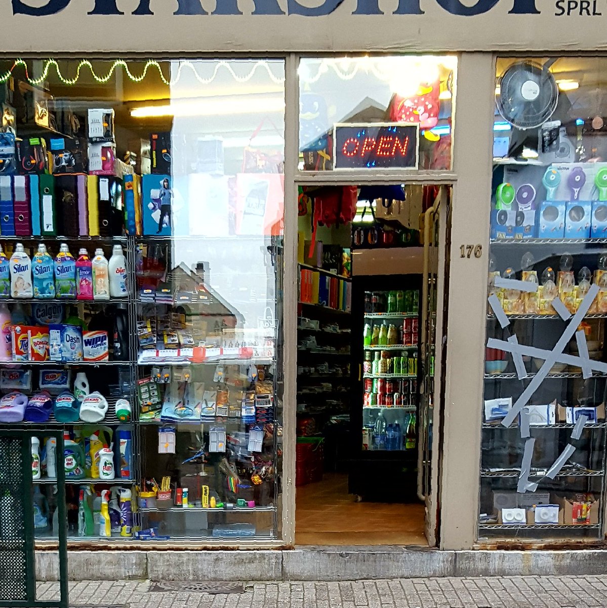 i like it when tiny shops really max out their window displays