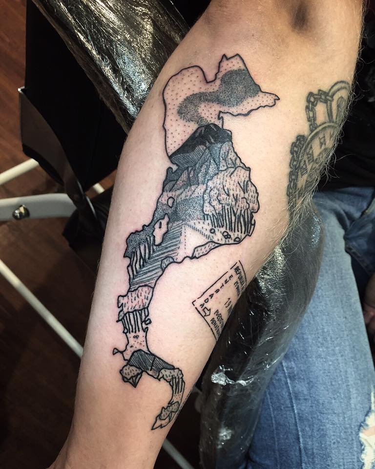 We LOVE how Chessie has captured his unique travel memories in these fun black work designs for the lovely Charlie✈️🛶🏔🏝🌋 #tattoos #uktattoo