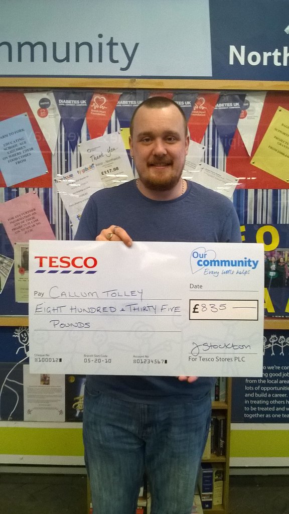Callum Tolley daddy receiving a cheque for £835 raised instore.Callumsin isolation. @ThomasRichard14@rachelannabel