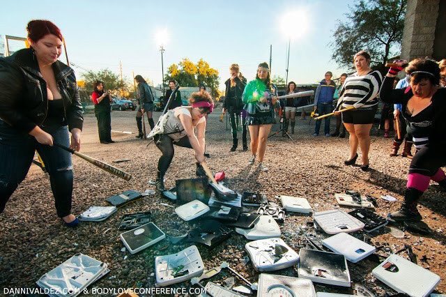 PrisonPlanet's tweet image. Fat third wave feminists are literally at war with reality.

Yes, they're smashing up weighing scales.