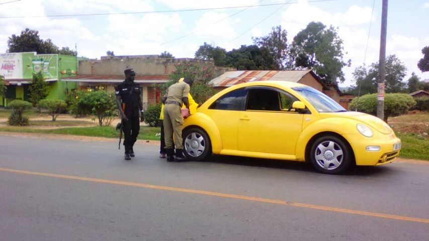 DailyMonitor's tweet photo. MP Abiriga spotted at Bombo Nakatonya area refilling his car using a jerry can, after it ran out of fuel https://t.co/92N1CuXd0h
