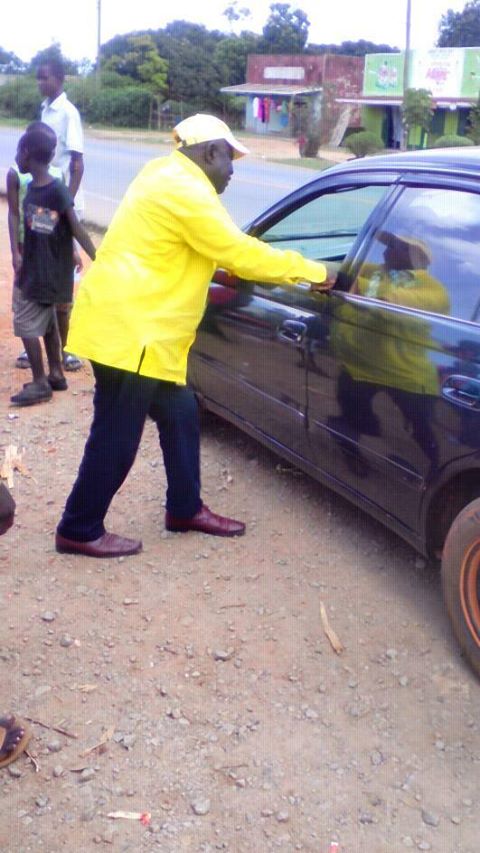 DailyMonitor's tweet photo. MP Abiriga spotted at Bombo Nakatonya area refilling his car using a jerry can, after it ran out of fuel https://t.co/92N1CuXd0h