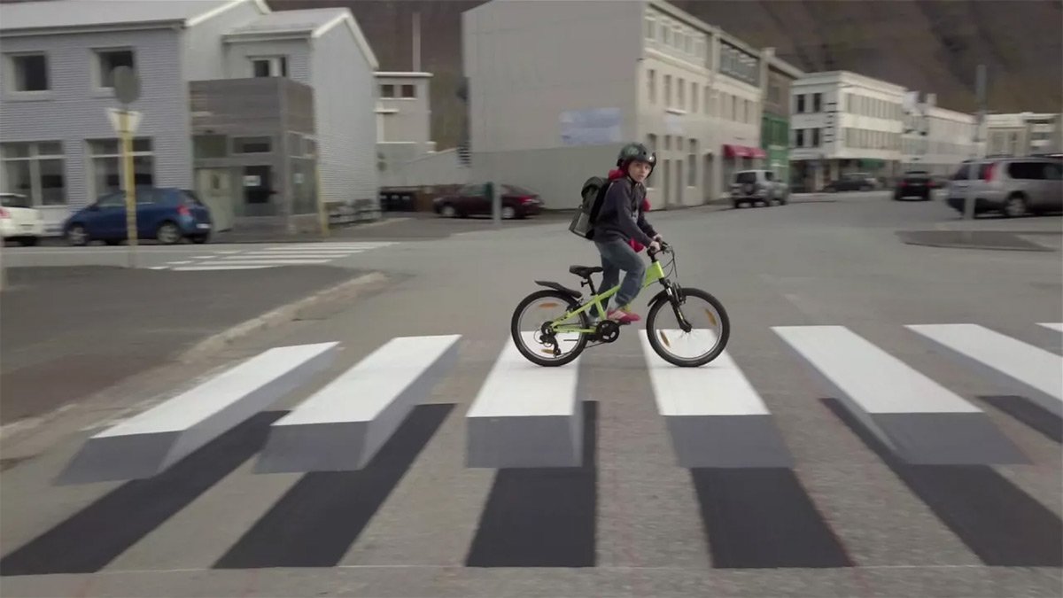 thisiscolossal's tweet photo. A 3D zebra stripe crosswalk appears in Iceland. https://t.co/u8r23WFxnl https://t.co/Y685KHGfWJ