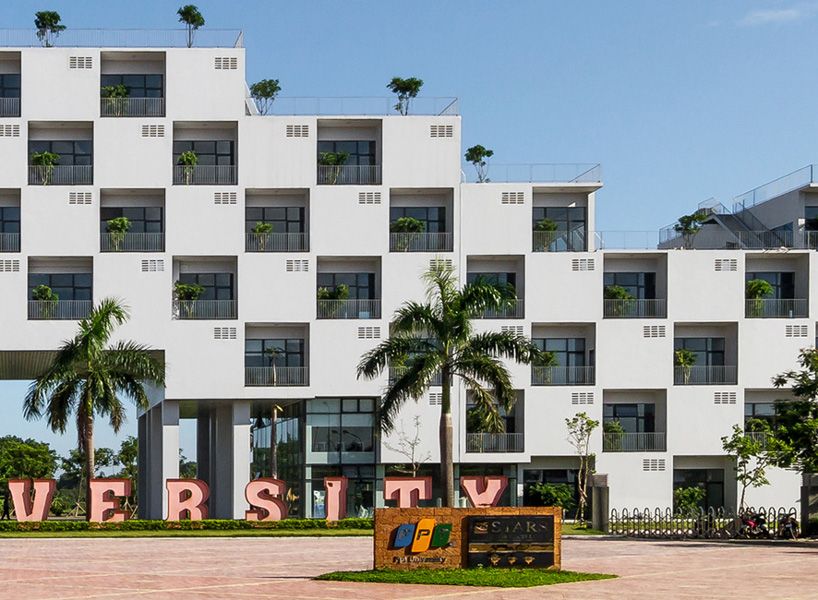 designboom's tweet photo. checkerboard façade of VTN's hanoi university building contains trees within recessed voids https://t.co/QLsKIju7mP https://t.co/THk7Bbh0UY