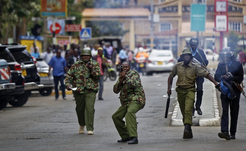 t_mcconnell's tweet photo. Photographer Ben Curtis on the wrong side of police lines in Nairobi today, for @AP_Images https://t.co/Tc6EpXHxLf