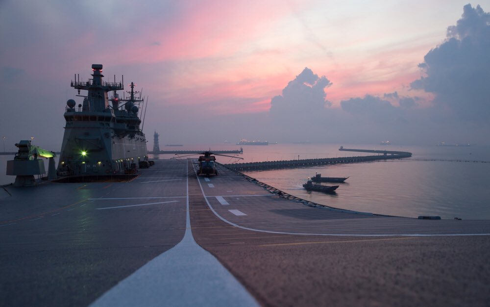 RayGriggs_'s tweet photo. #POTD #LHD Landing Craft depart #HMASAdelaide at sunrise while training in Singapore as part of #IPE17 https://t.co/O1zjxYArij