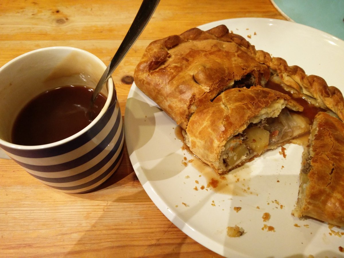 laura_yarrow's tweet image. My fusion dinner of a cornish pasty bigger than my head and mug of gravy, that's a legit meal, right?! #northener in #Cornwall