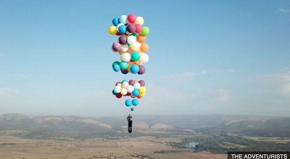 BBC's tweet photo. A man has flown 25km above South Africa suspended from 100 helium balloons. 🎈 https://t.co/lc4aqKm1Pq https://t.co/z87WjSuHUV