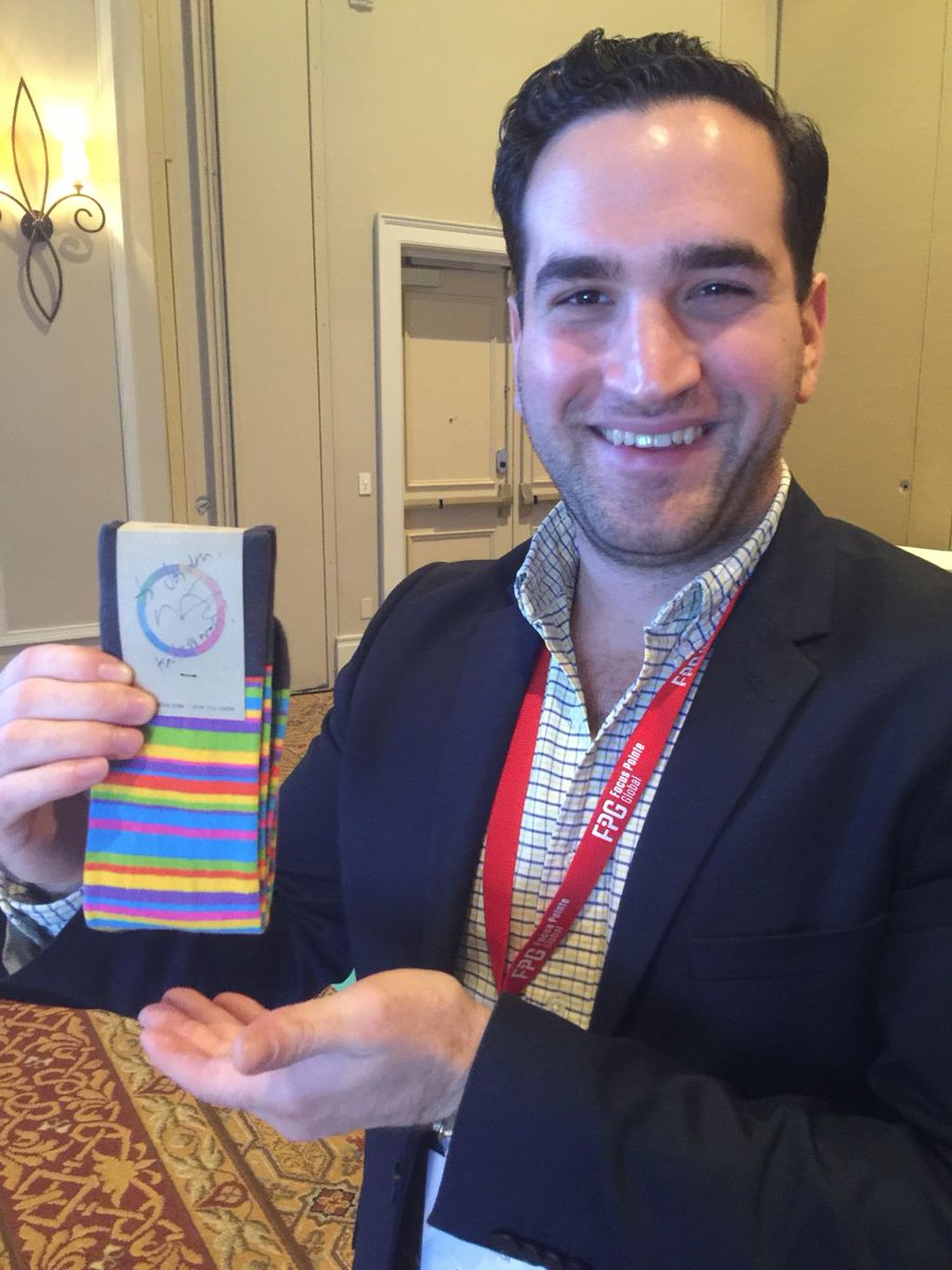 Brandwatch's tweet photo. It's official. Malcolm @Gladwell loved our socks. Our very own @JordanPinzolo poses with his signed pair. https://t.co/hrUpeX3sJJ