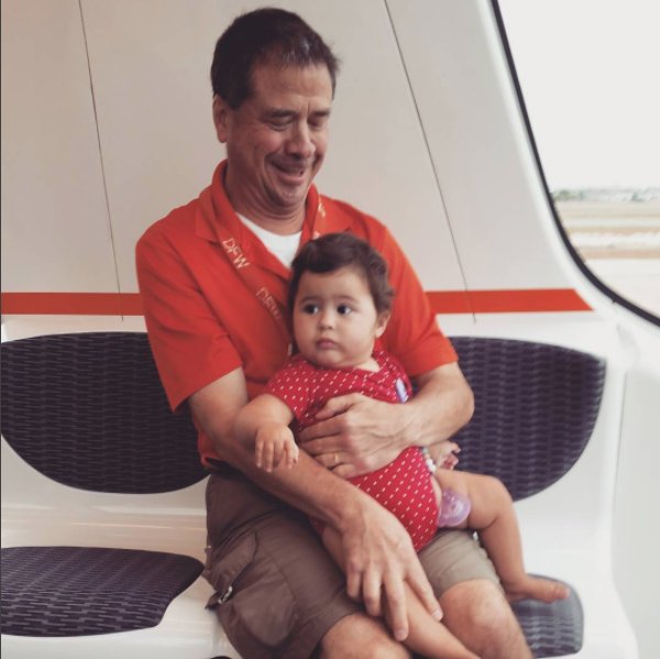 sariahmasterson's tweet photo. DFW Airport Employee, Steve Krum takes his grand-baby, Lydia, for a ride on a recently refurbished SkyLink car! @DFWAirport @stevekrumcpa #TexasForever https://t.co/KguUoESlLs