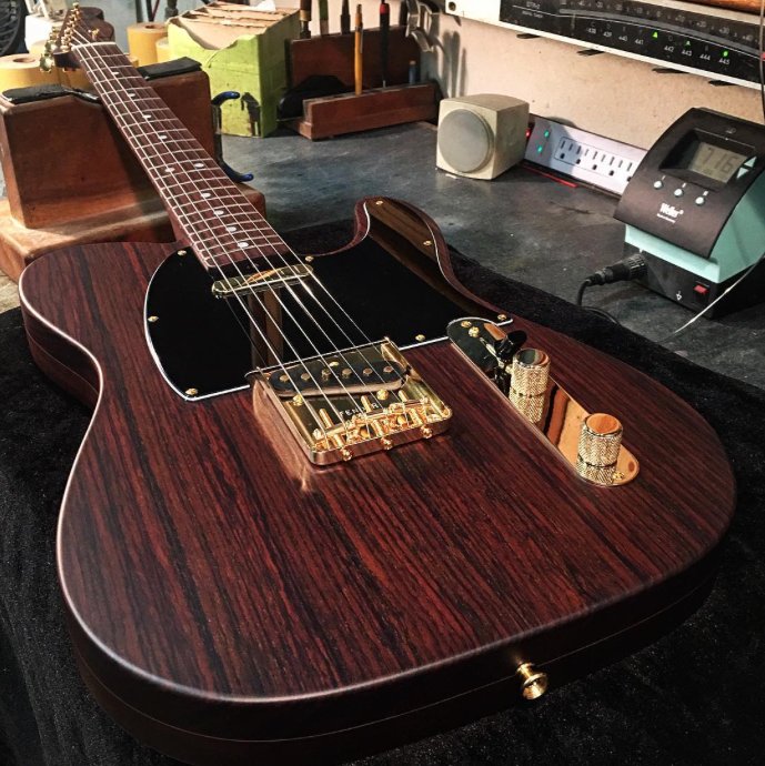 Fender's tweet photo. Some #TeleTuesday rosewood goodness from the Custom Shop. Built by @dwilson_fender https://t.co/D9m8BydFfB #Telecaster #Guitars https://t.co/urlVfkeypI
