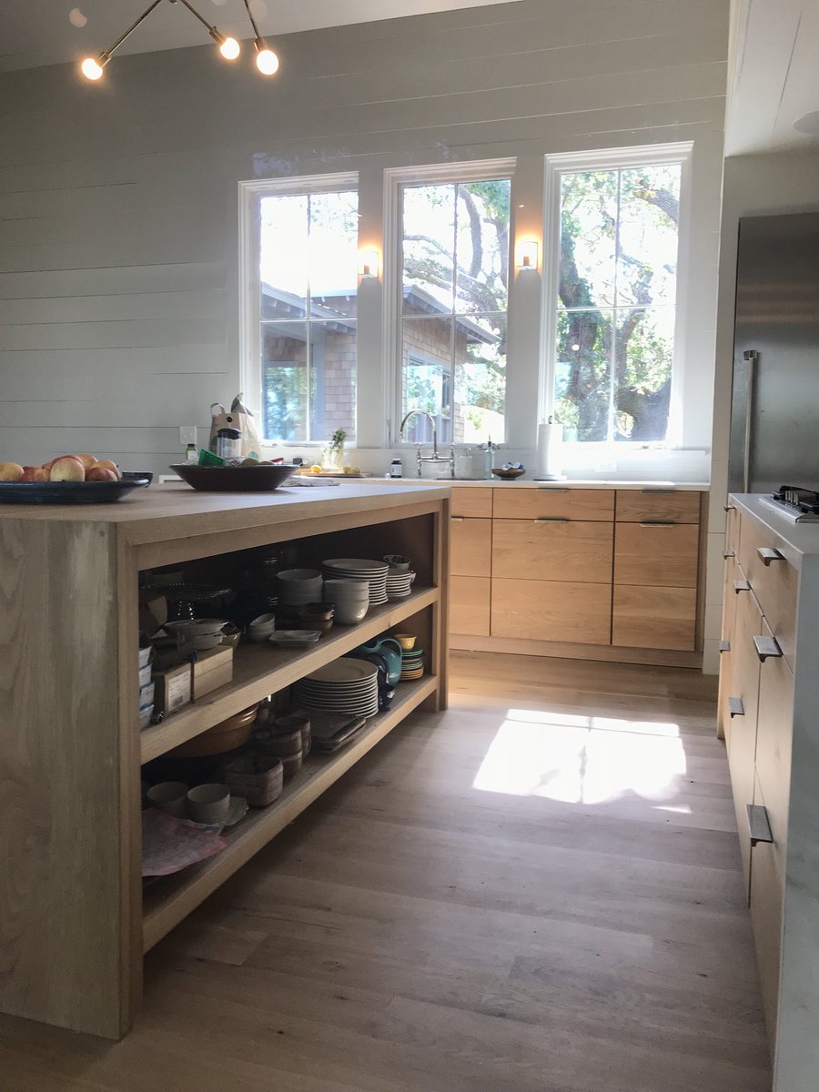 Check out this custom kitchen! It has flat panel drawers and a waterfall Island. Let us redo yours! #woods #woodscabinets #customcabinets