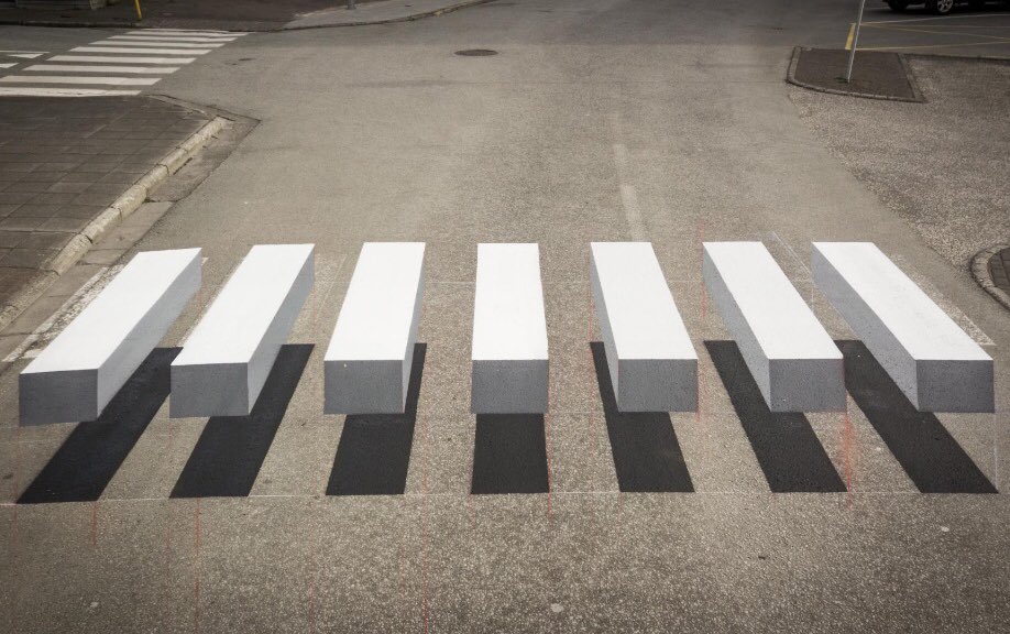 Using design to slow traffic in a small town in Iceland by painting a zebra crossing to look like its 3D via <a href="/hiutdenim/">Hiut Denim</a>