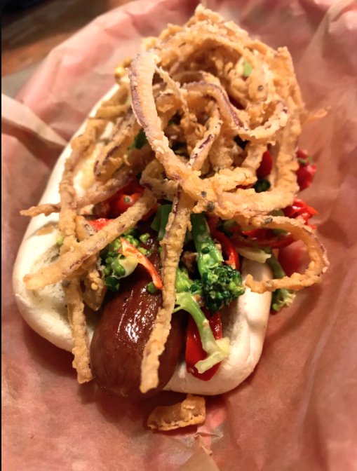 PeppadewUSA's tweet photo. Our snack today has some crunch! @FBHuntsville grassfed beef hot dog topped with broccoli, bacon, crispy onions, and #peppadew slaw. https://t.co/52Yvt22D5w