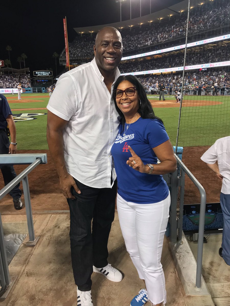 MagicJohnson's tweet photo. Cookie and I cheering on our @Dodgers to their first 2017 World Series victory! https://t.co/ySVU9ur1gq