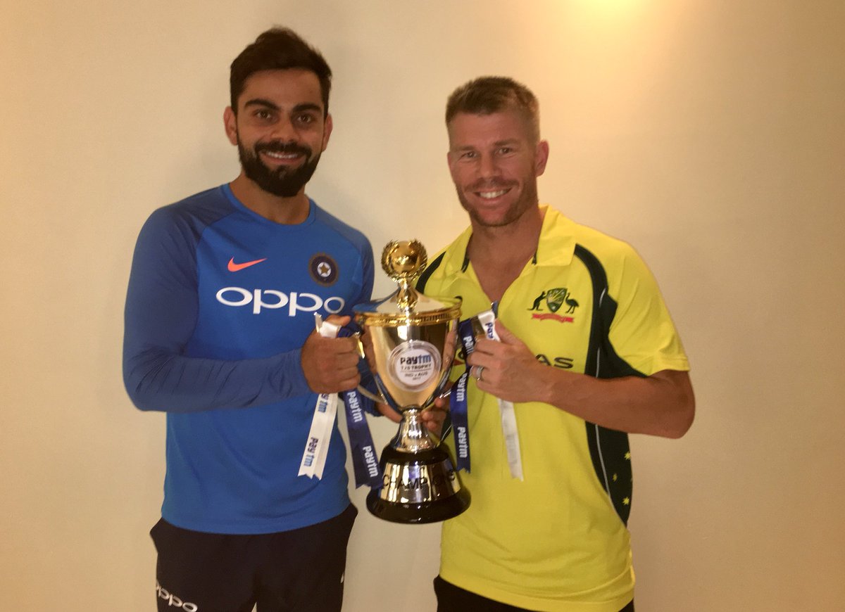 TeamVirat's tweet photo. The Two Captains @imVkohli &amp; @davidwarner31 Share The @Paytm Trophy! #INDvAUS https://t.co/Fwp7QUUpn1
