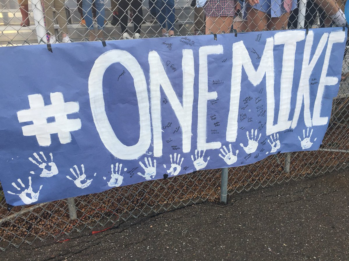 katieleszcynski's tweet photo. Signs at the FB game to show @NPHS_Eagles is remembering Michael John, the senior that passed away this week. #onemike https://t.co/8kHDS2aCIF