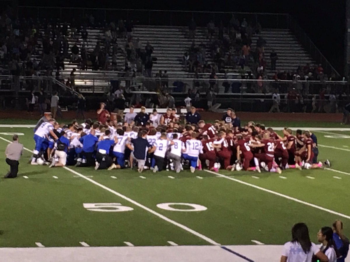kapauncrusaders's tweet photo. KMC defeats St. James 28-27 in overtime. Both teams in prayer after the game. Go Crusaders! https://t.co/2lRIESXYvw
