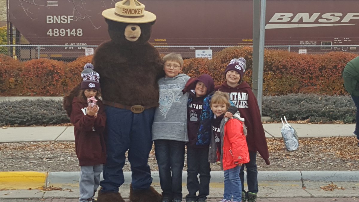 The kids of AT&amp;T with Smokey at the University of Montana Homecoming parade.#lifeatatt