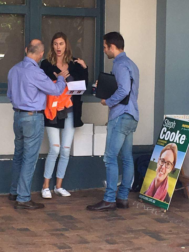 mark3eb1's tweet photo. @SteveLarsson @sffAustralia @2GB873 @NSWNationals National staffer #busted handing out illegal material. her face says it all. https://t.co/YYHZ19F5EX