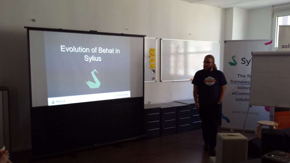 Sylius's tweet photo. Another lightning talk at #SyliusHackathon: Evolution of #behat in Sylius by @mpzalewski. #php #testing #bdd @behat https://t.co/s6szZCja5X