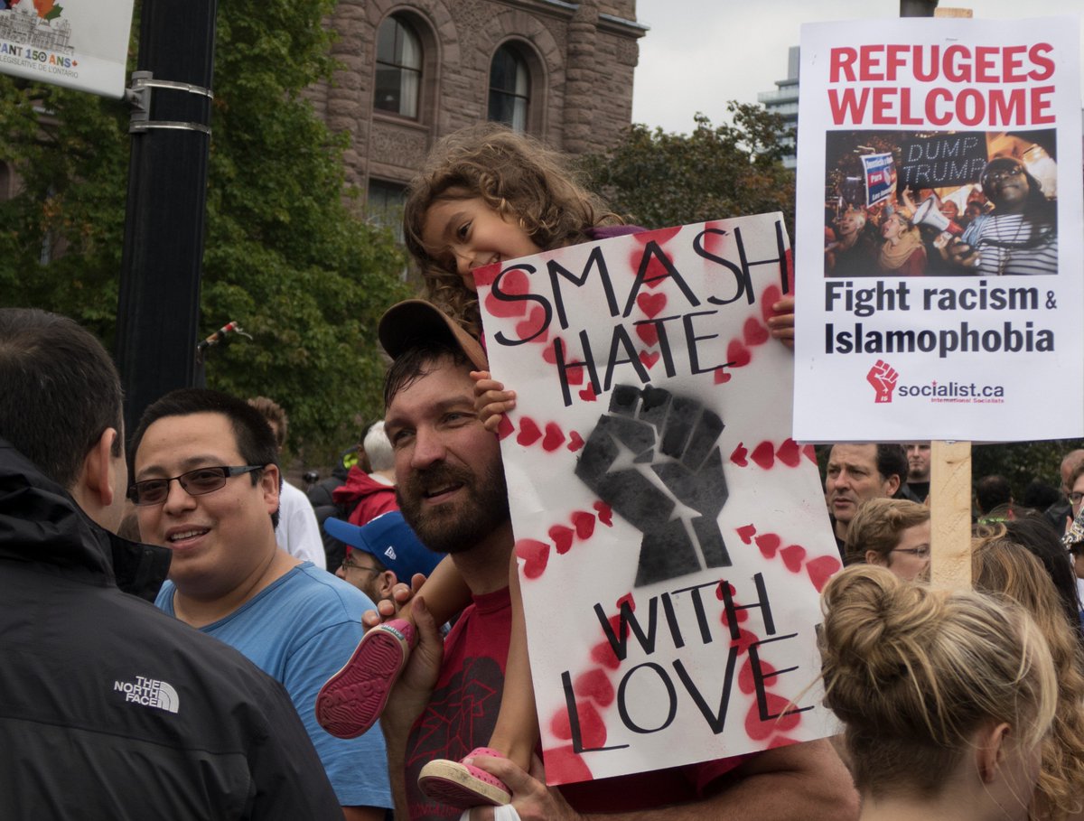 MKe11yMedia's tweet photo. Photographers swarmed to get a shot of this little girl at the #UnityTO rally in #Toronto https://t.co/Rw4VsUgiiY