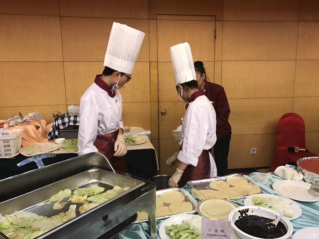 nathanking's tweet image. so when did the Republicans or Democrats lay on a spread like this for journalists ? yup that's a Peking duck station! #CPC17 @cgtnamerica