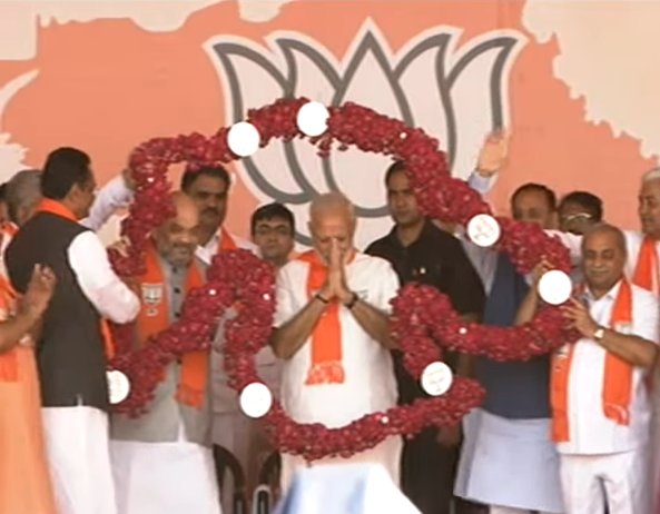 BJP4India's tweet photo. PM @narendramodi &amp; Shri @AmitShah at #GujaratGaurav Mahasammelan in Bhat Gaam, Gandhinagar. Dial 02245014501 to hear LIVE. https://t.co/tox3zeviDD