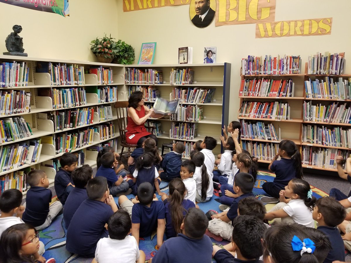 virginialoh's tweet photo. @choldenko reading aloud to Kinder kids at Logan @SDSUAztecs4Ed https://t.co/3hONjx04fB