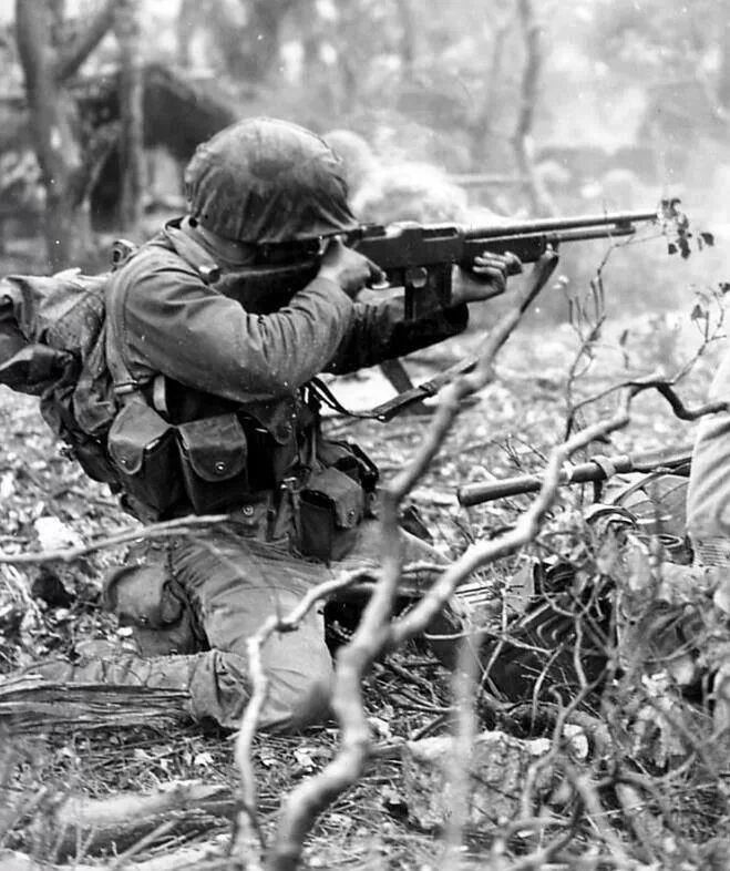 thewaryears's tweet photo. WWII Picture of the Day - A US Marine infantryman firing a BAR at enemy positions. https://t.co/qCfDWnWHs1