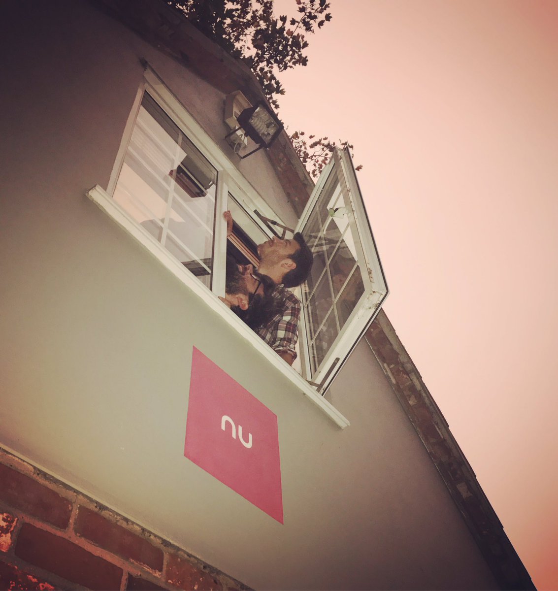 NuImageDesign's tweet photo. Our designers have popped out to see what all this #REDSUN fuss is about #redsky #opheliahurricane #norfolk #apocalypse #OpheliaStorm https://t.co/v1U7ct046s