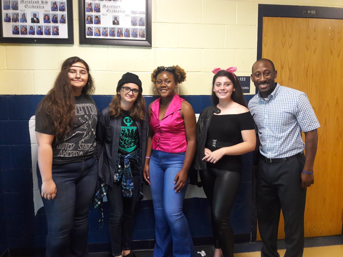 mainlandstrings's tweet photo. Kicking off Homecoming week in the best way possible! Orchestra showing off our decades 💙💛 https://t.co/6XjyXymbz0
