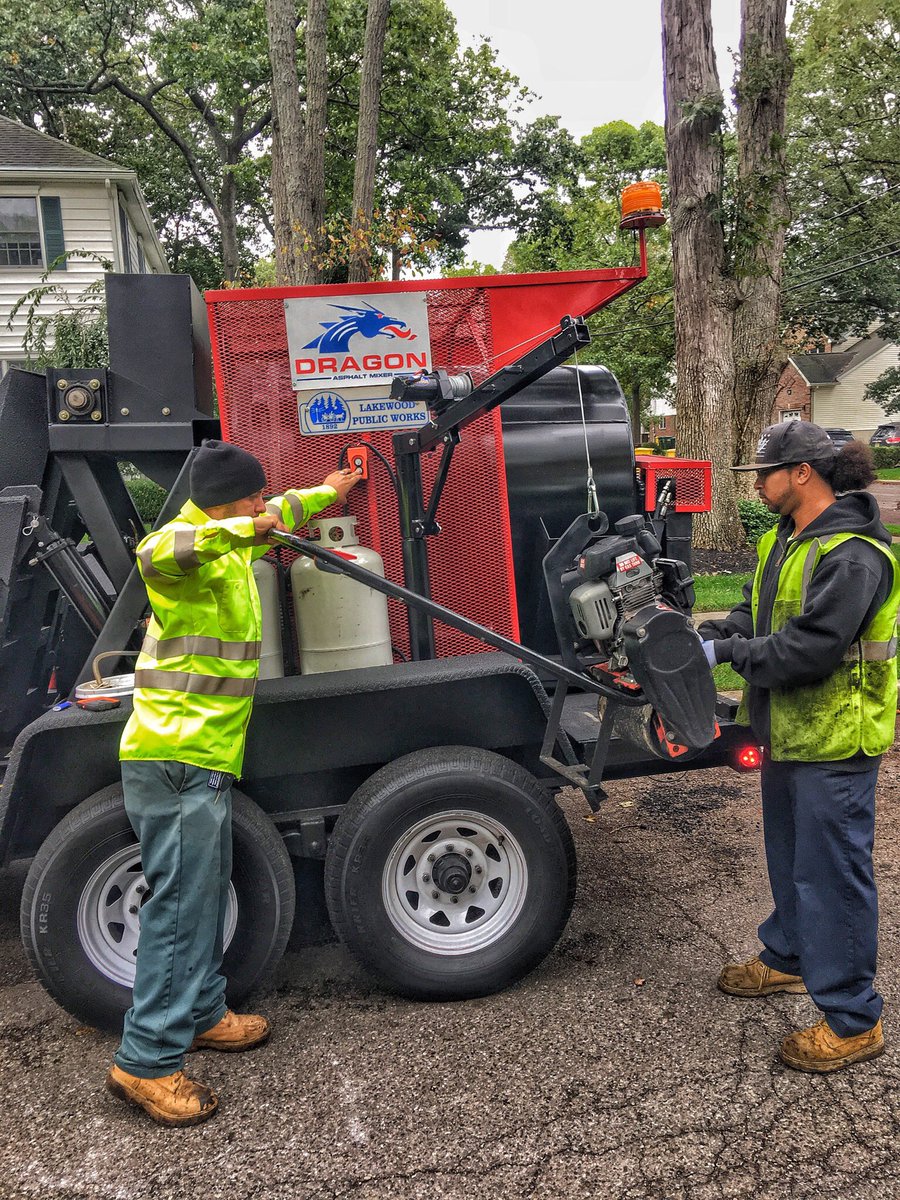 DragonAsphalt's tweet photo. We ❤️ this picture of Lakewood's DPW filling potholes using their Dragon Asphalt #Mixer to create fresh hot-mix #asphalt from just #Millings https://t.co/zdn9EJxblt