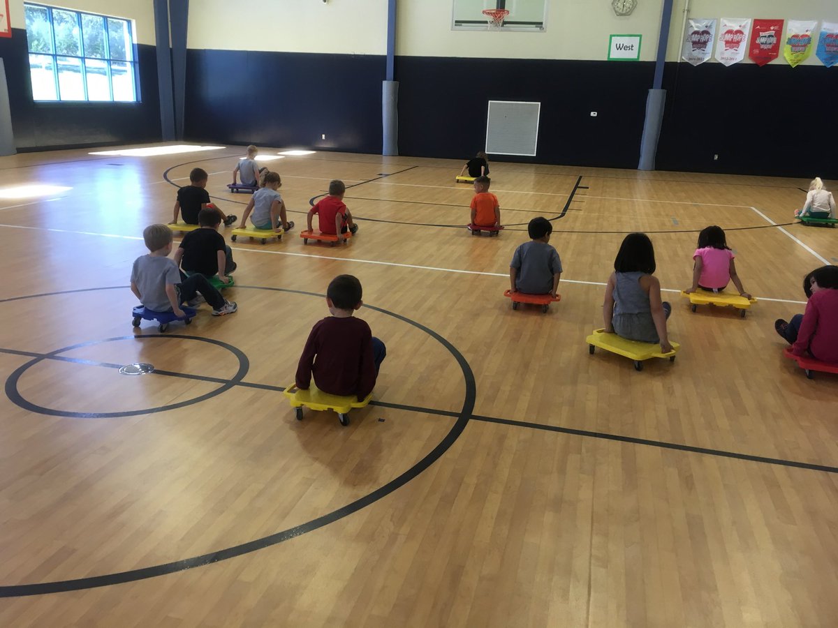 CLHS_Counselor's tweet photo. Kindergarten mastering driving skills and muscular endurance...scooter board style! #BeAChampion #ASESPE @ASE_Mavericks @ComalPhysED https://t.co/NRrLS1pSd0