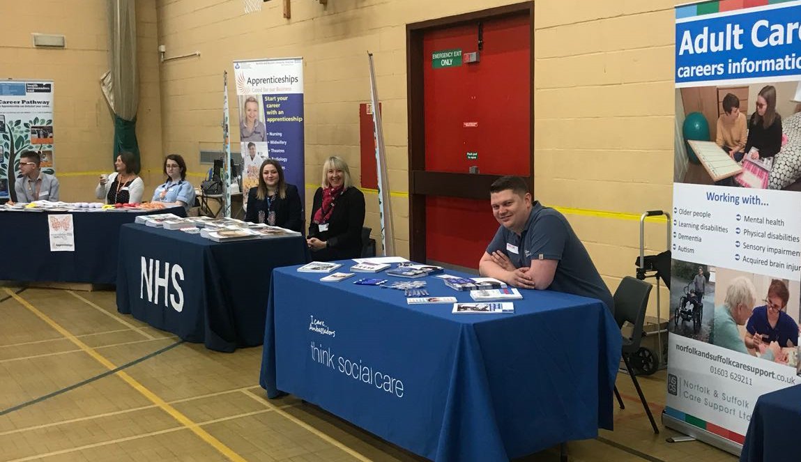 NSCSLtd's tweet photo. I Care...Ambassador Chris (@TheraTrust) set to promote care careers, alongside health colleagues at @sprowstonhigh @BeaconEast1 Careers Fair https://t.co/tw9AjMxNVX