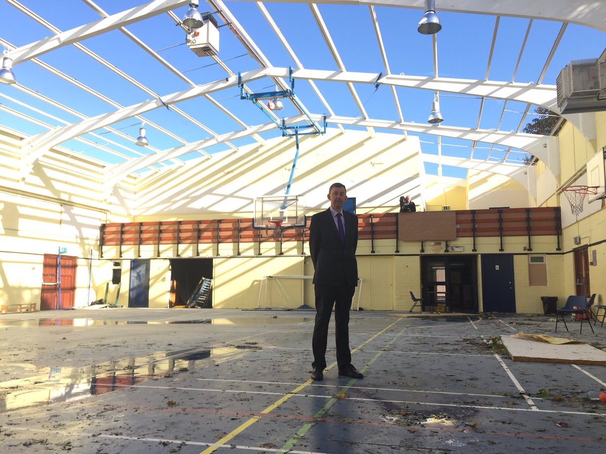PaschalSheehy's tweet photo. Jim Long has been at Douglas Comm in #Cork for 37 years. The sports hall was there before him. #Ophelia ripped off its roof in minutes. https://t.co/6DLqhepOC0