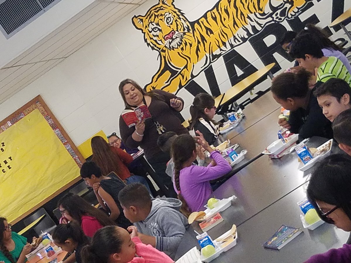 Ms. Lopez reading to the fifth grade students during their lunch!  Positive Expectations for all! 📚📚📚  #EffectiveTeaching  @McAllenISD