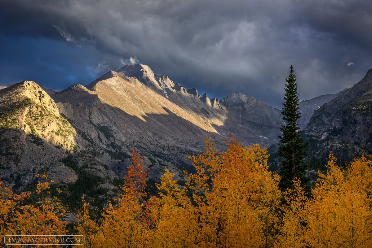 ErikThePhotog's tweet image. I spent an evening soaking in the silence as I watched the light break through the storm clouds above and light Longs Peak. #RMMP