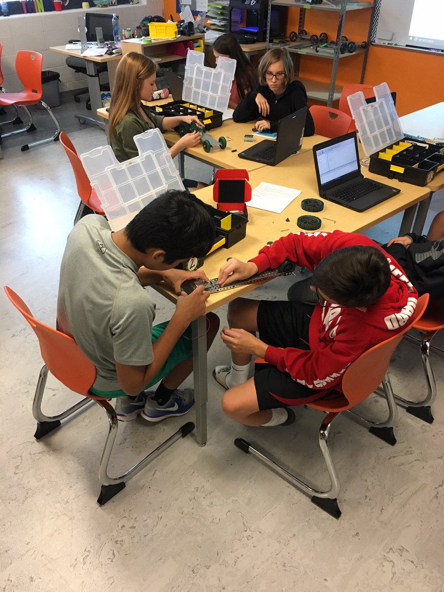 love4STEM's tweet photo. SMS Robotic students brainstorming &amp; making programming adjustments on their dragsters before the big race! @smsstangs @polariscareer https://t.co/FgdUzyUBN1