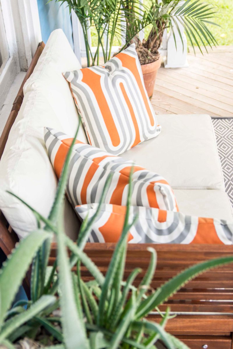 These outdoor throw pillows from <a href="/DecoratorsBest/">DecoratorsBest</a> add some contrast to Tye Street porch with a graphic orange: bit.ly/2x0dyB5 #ad